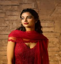 Meenakshi Chaudharys Stunning Photoshoot in Red Salwar Suit
