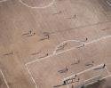 The Soccer Stadium Lying On Two Hemispheres