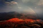 rainbow over red land, china