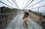 China Opens Longest Glass-Bottomed Suspension Bridge